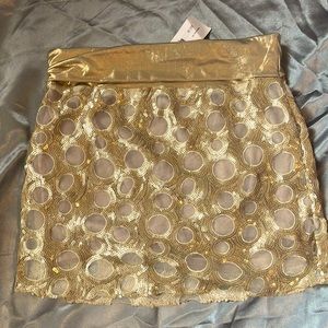 Cute gold mini skirt. New never worn